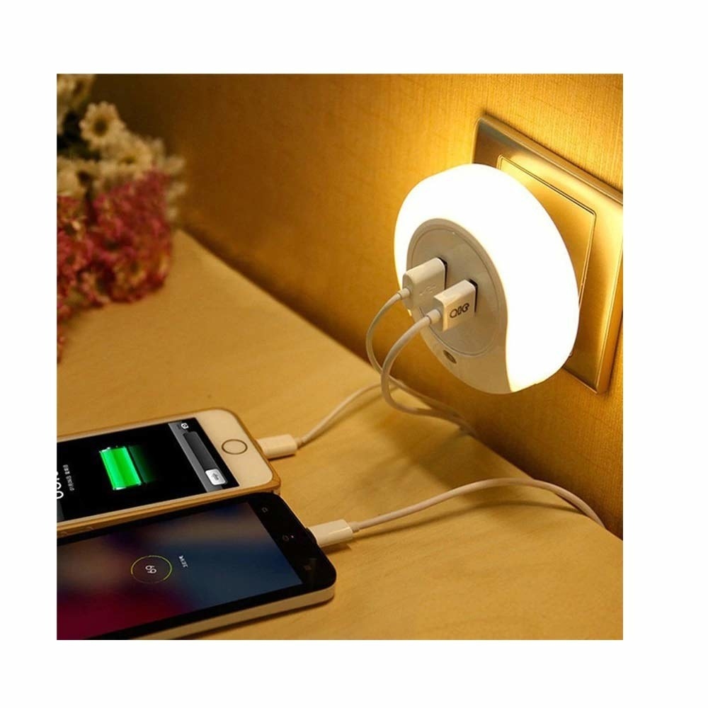Two phones being charged using the lamp charger 