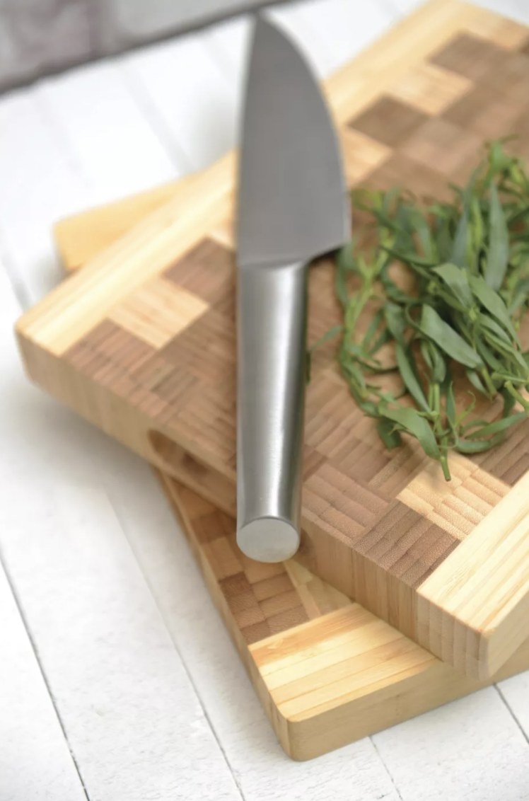 the checkered cutting board with dark and light wood