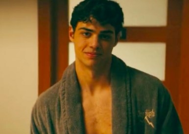 Peter looking right into the camera while wearing a robe