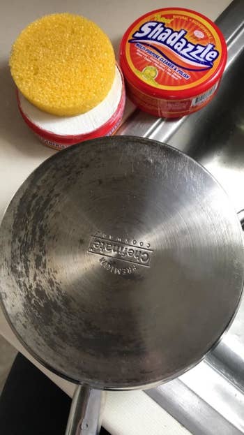a stainless steel pan half clean and half dirty