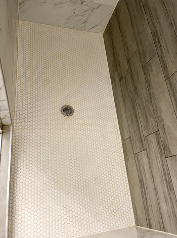 Same reviewer's after picture of perfectly clean shower tiles 