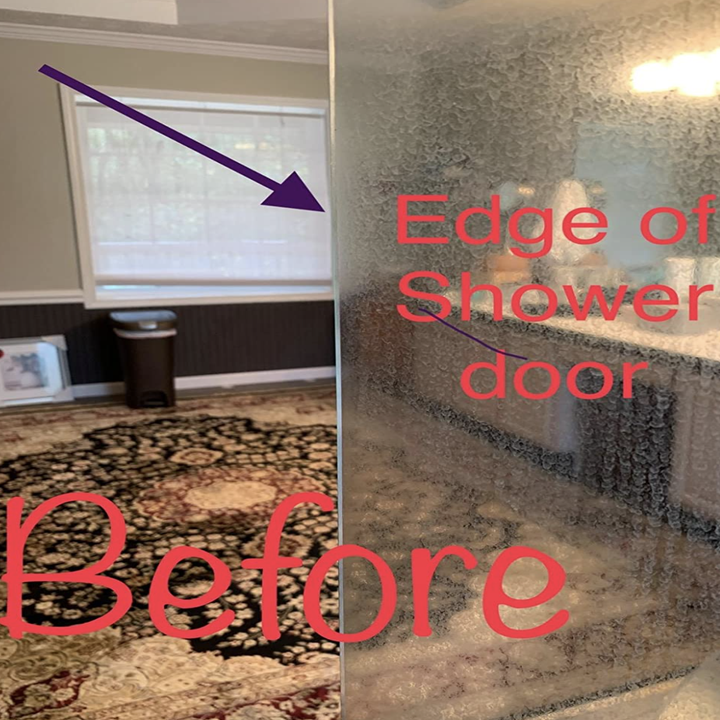 a reviewer's glass shower door looking fogged up from hard water stains