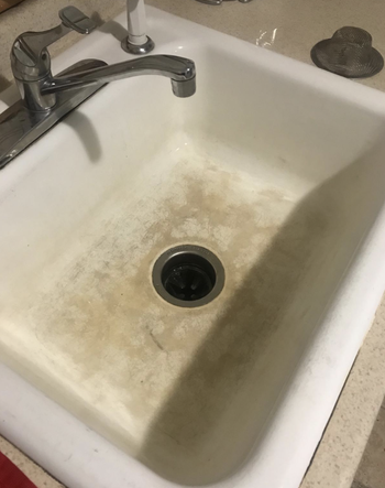 a reviewer photo of a sink looking dirty