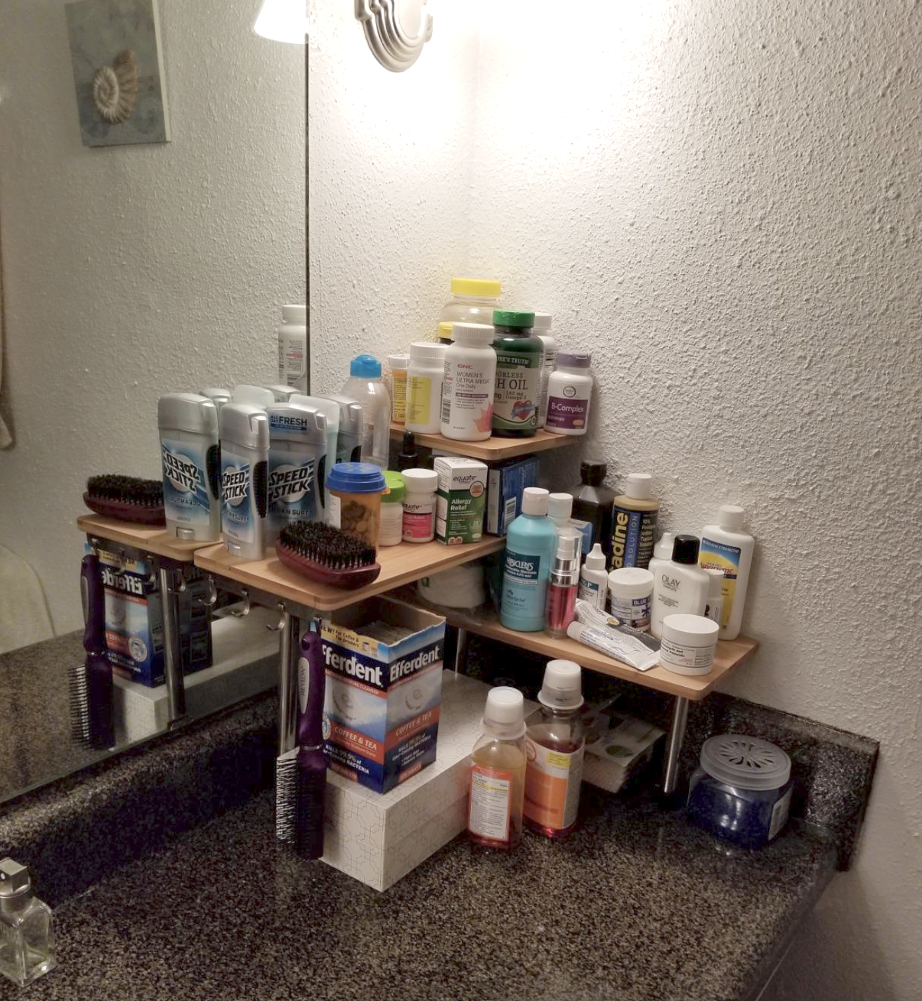 reviewer image of rack in bathroom holding tons of things