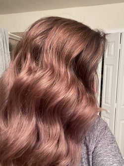 Reviewer showing hair after using argan oil mask