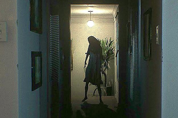 A scary ghost at the end of a hallway