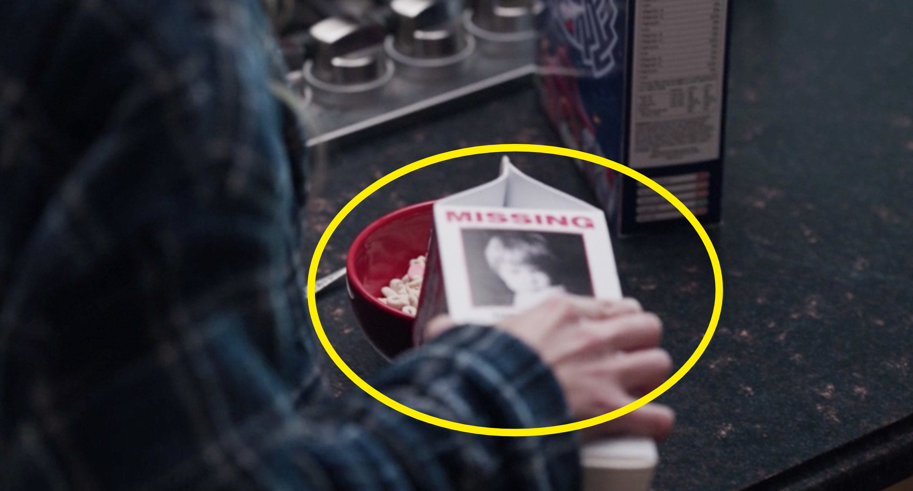 Wanda pouring milk from a carton that features a photo of a missing child