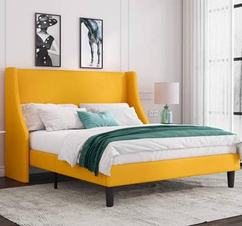 the upholstered bed frame in yellow