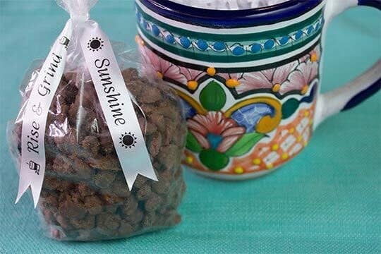 Chocolate-covered coffee treat with personalized ribbon.