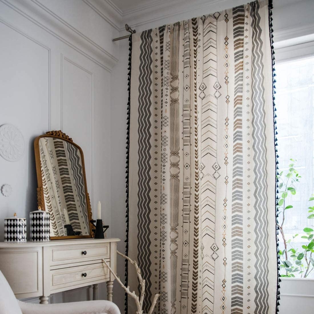 Geometric curtain with tassels on the edges 