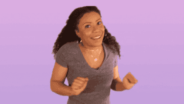 A woman dancing because she&#x27;s happy with her thrift finds