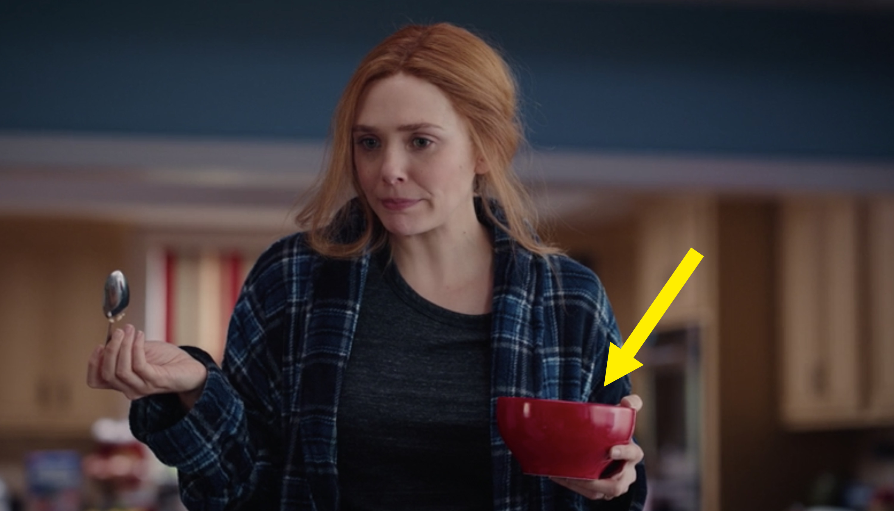 Wanda holding a red cereal bowl