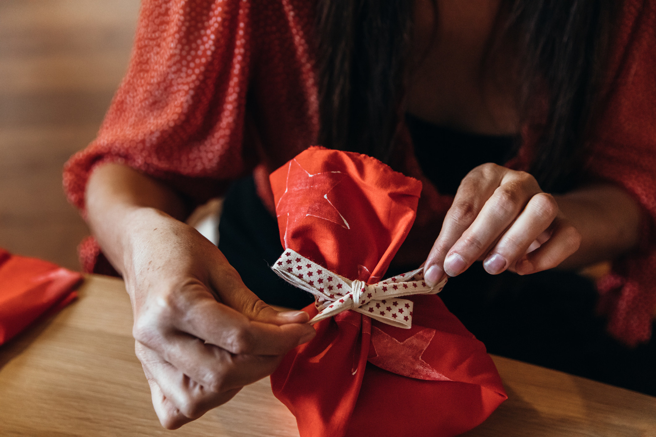 Person wrapping a gift