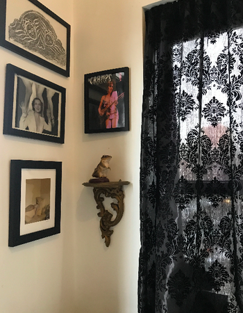 Image of my sister-in-law's bedroom with the patterned curtains in black. They have an old, victorian pattern. 