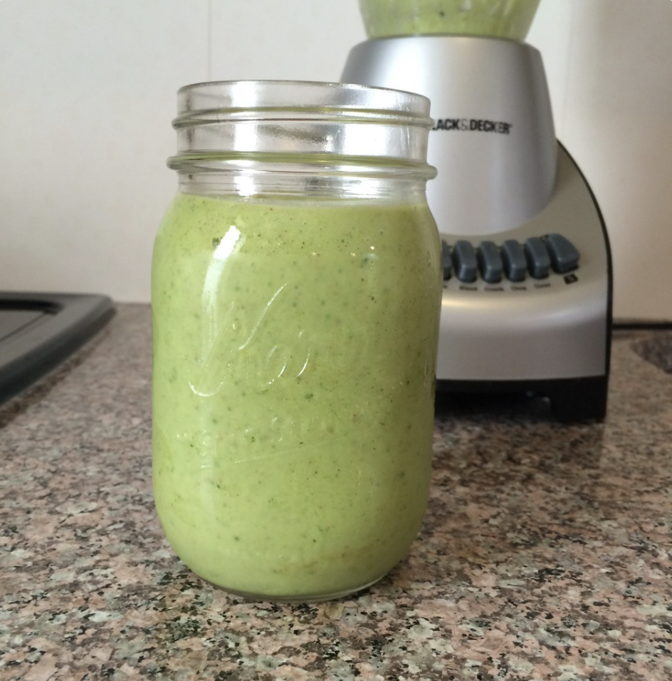 A green smoothie on a countertop
