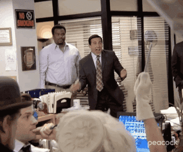 Michael Scott claps enthusiastically and says, &quot;Wow!&quot;