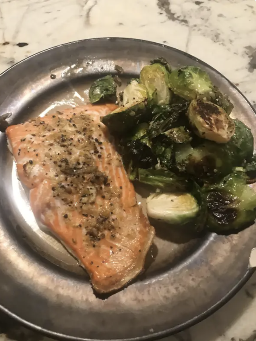 A dinner plate of salmon and Brussels sprouts