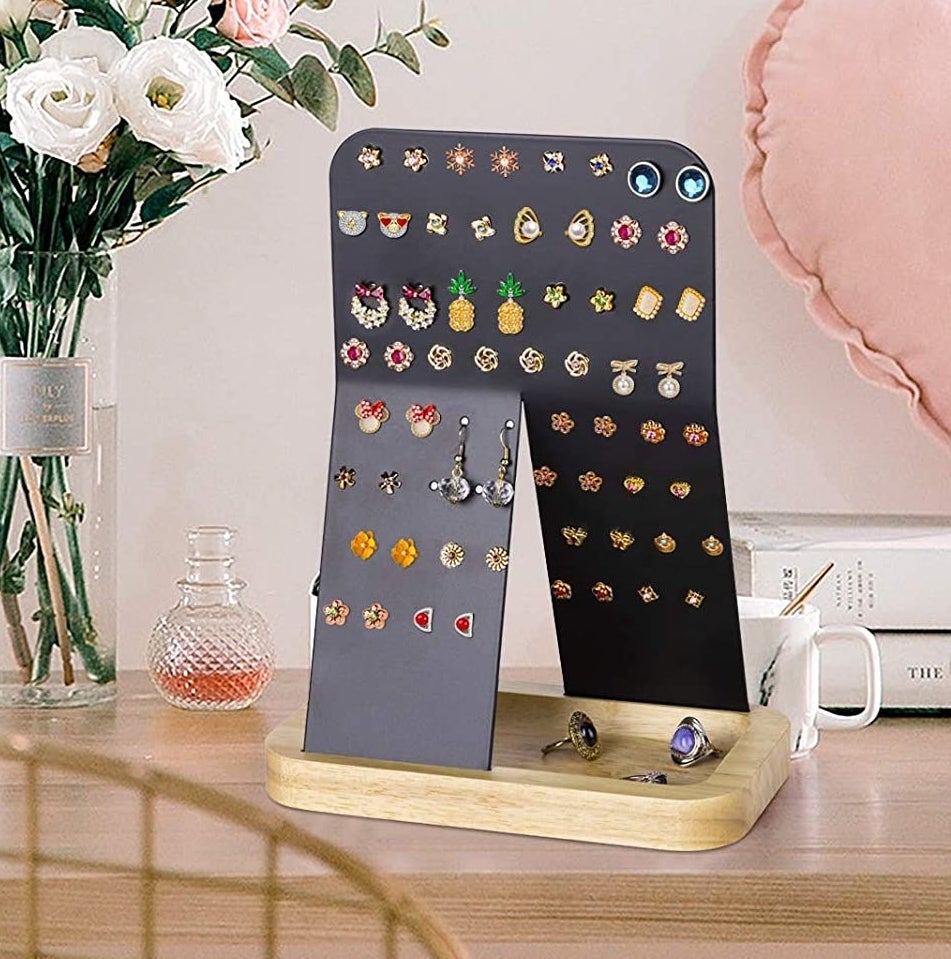 The display stand covered in earrings and jewelry
