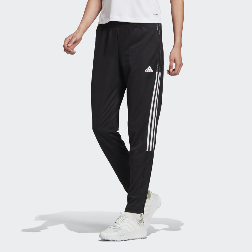 a model wearing the track pants in black