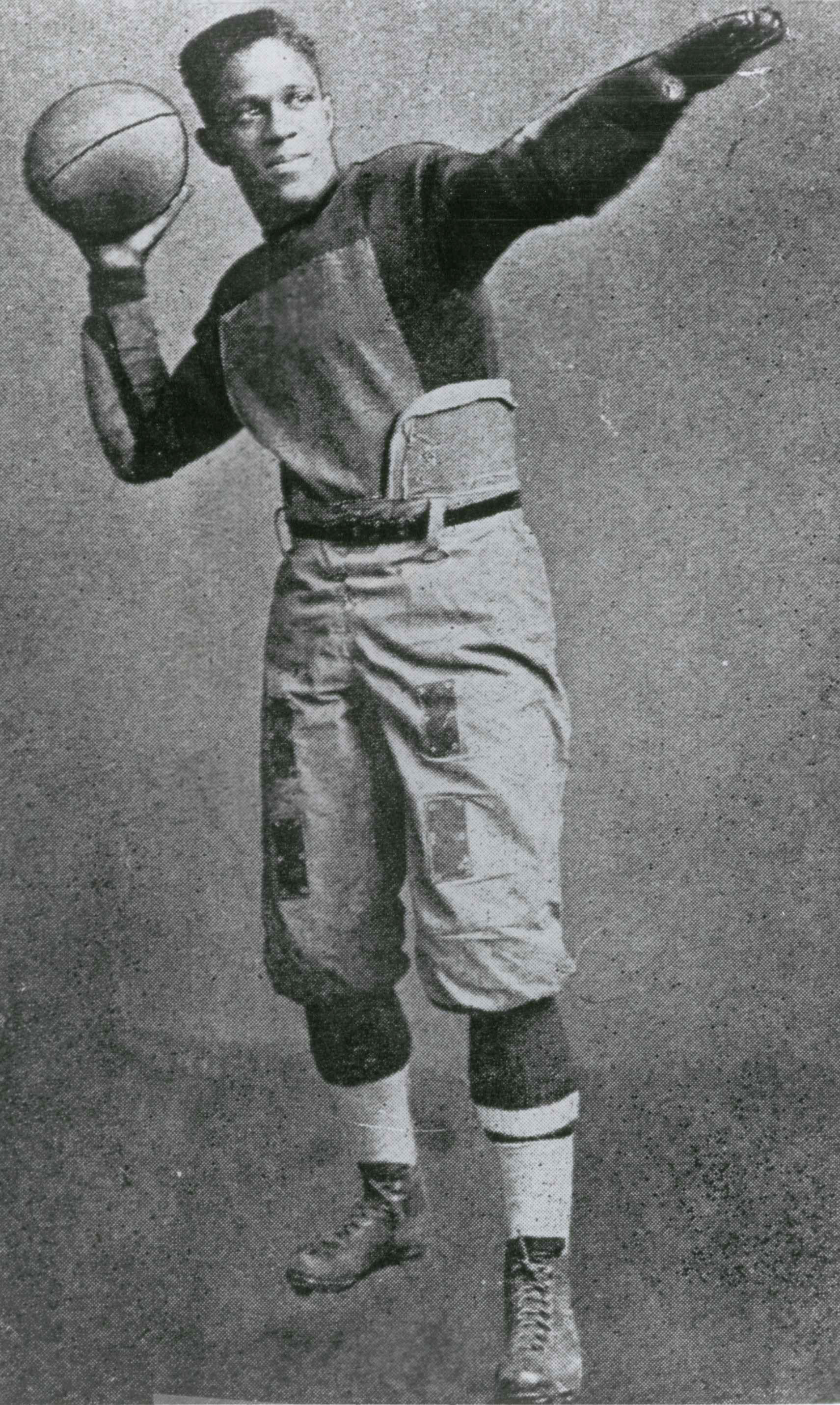 Fritz Pollard throwing football