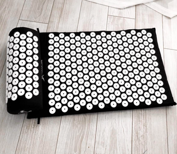 A customer review photo showing the mat and pillow