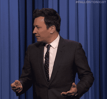Jimmy Fallon looking around in confusion and asking, &quot;What?&quot;