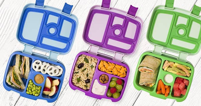 three bento boxes filled with lunches