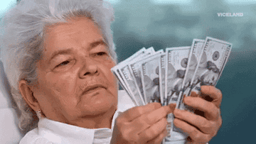 An elderly person counting money