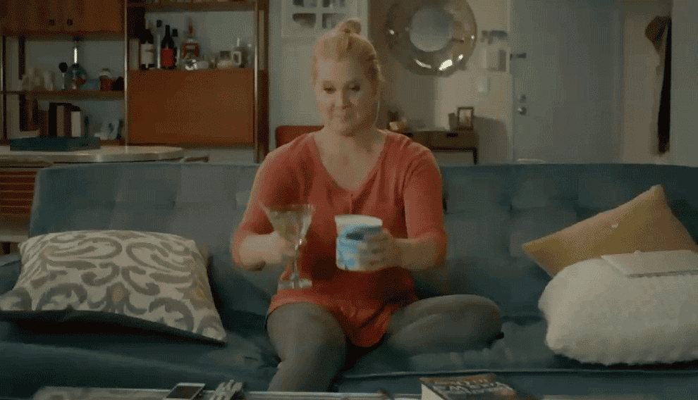 Amy Schumer eating ice cream and drinking a martini.