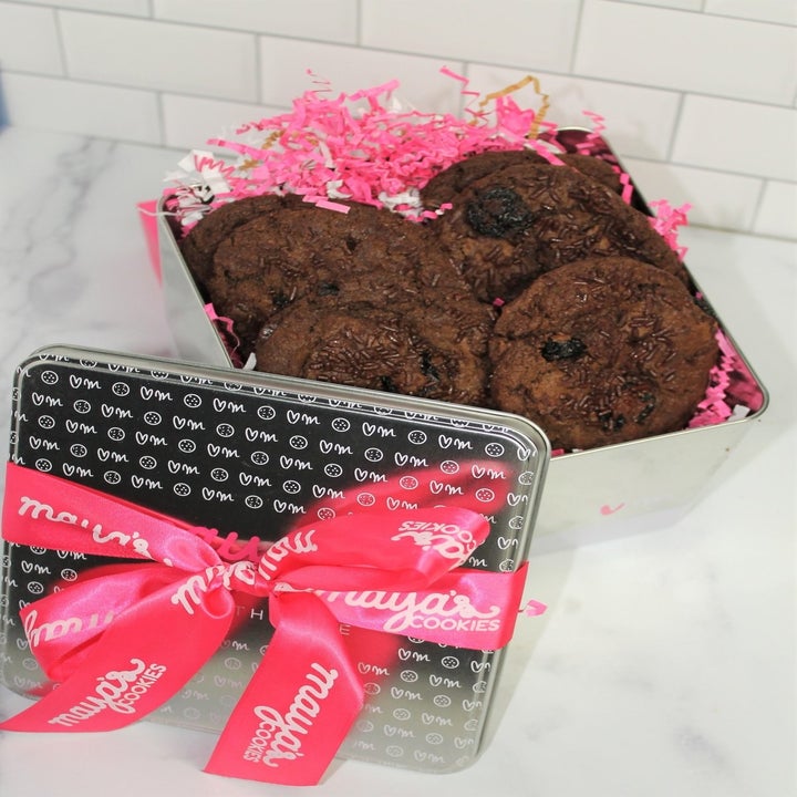 Silver tin of Chocolate Cherry Truffle cookies with a pink ribbon on top
