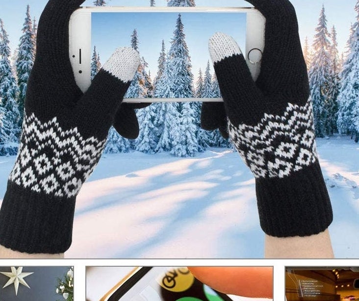 A person taking a picture while wearing the gloves