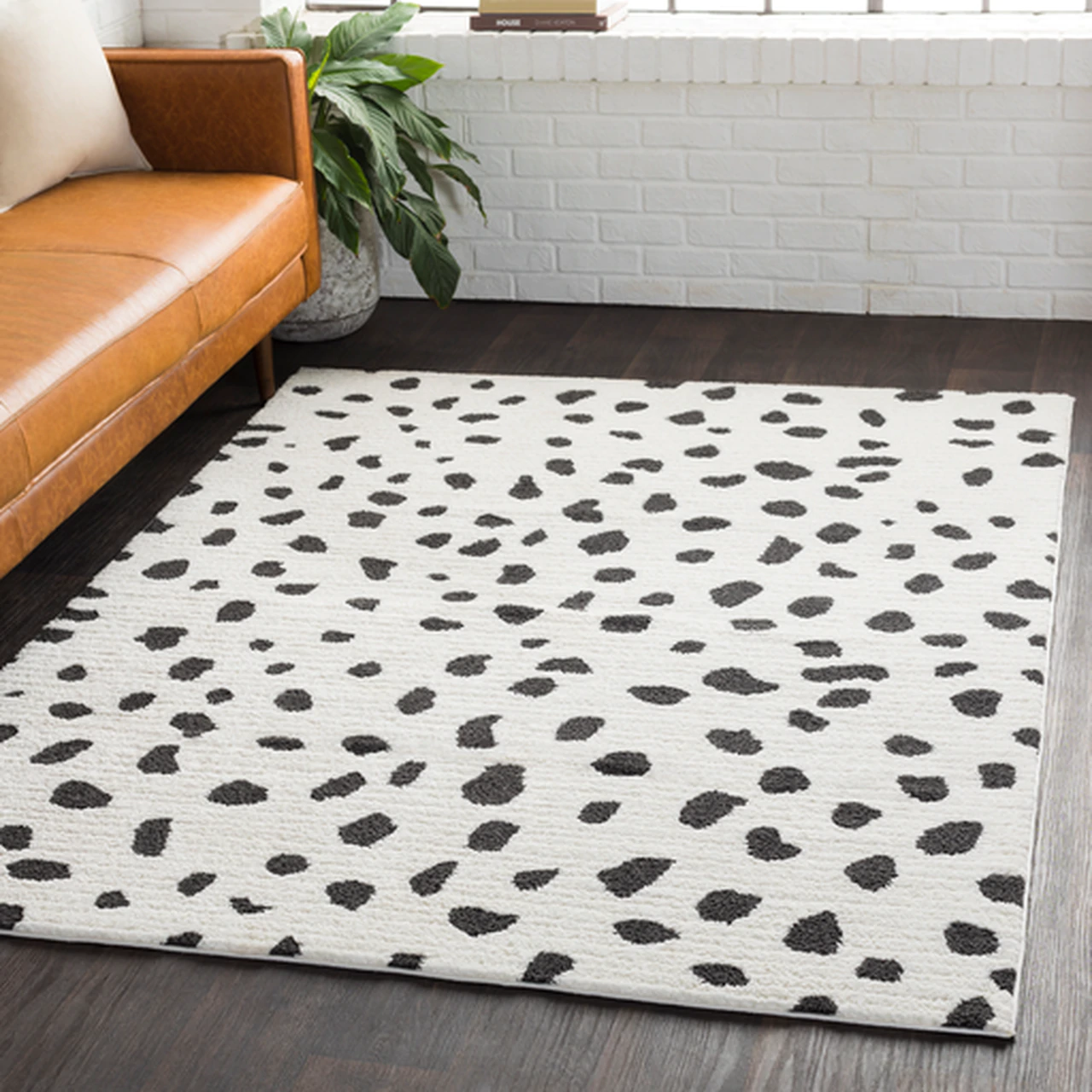 white rug with black splotches 