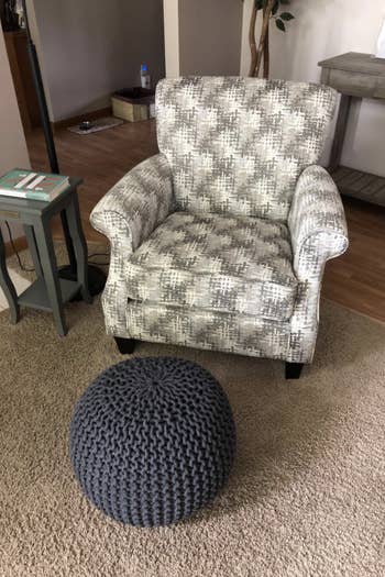 ottoman used as foot rest with armchair 