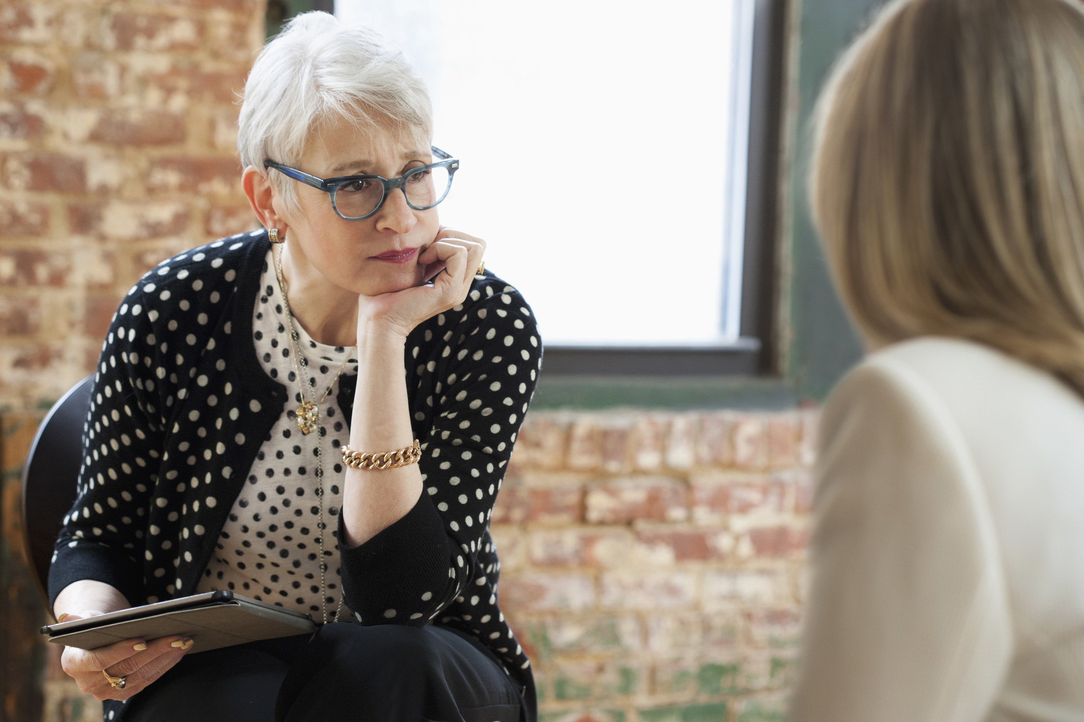 A therapist talking to a patient