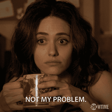 A GIF of a woman saying &quot;not my problem&quot;
