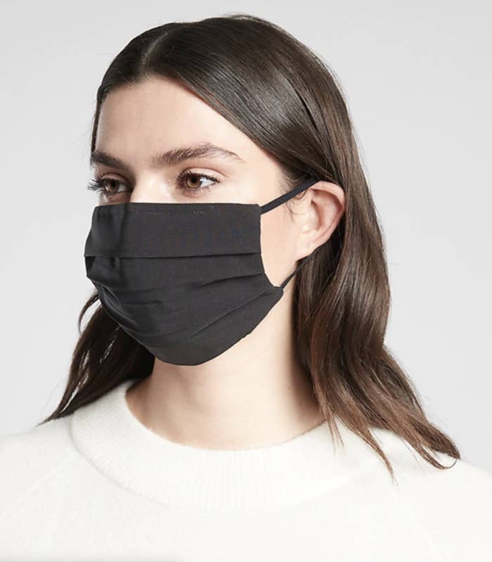 Model in a black face mask