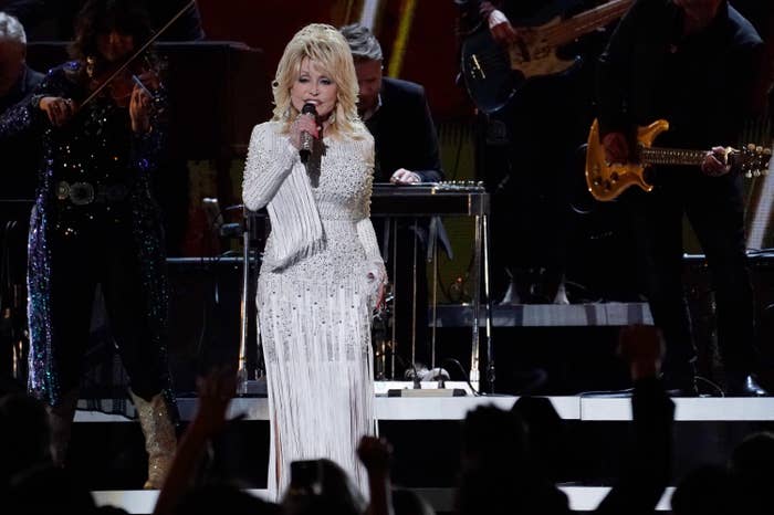 Dolly Parton, wearing a long fringe gown, performs at the 2019 CMA Awards

