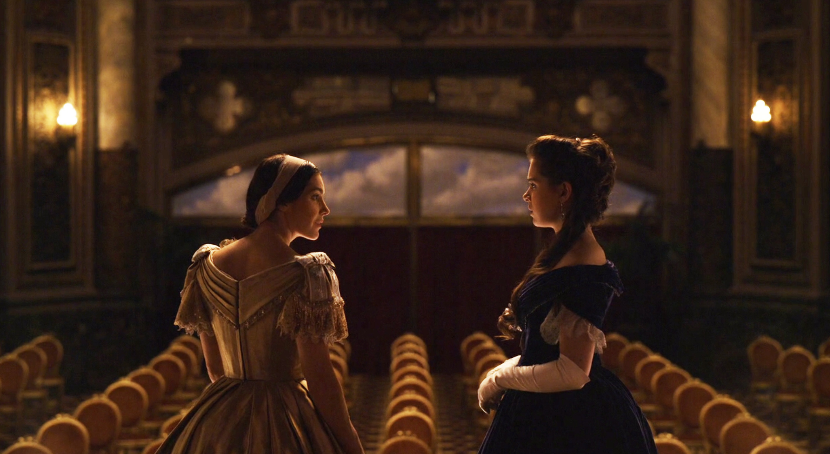 Hailee Steinfeld as Emily in Dickinson standing on the stage at the opera