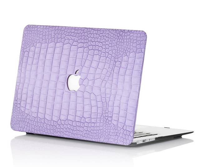 laptop with the lilac case on the back of the monitor