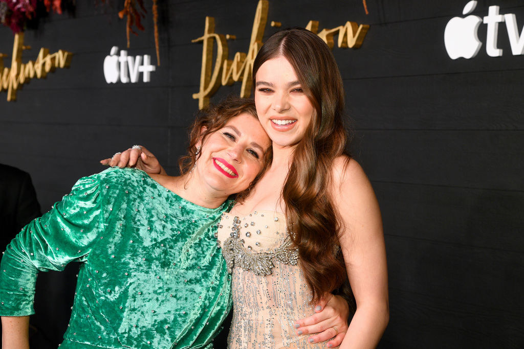 Dickinson creator Alena Smith hugging Hailee Steinfeld on a red carpet