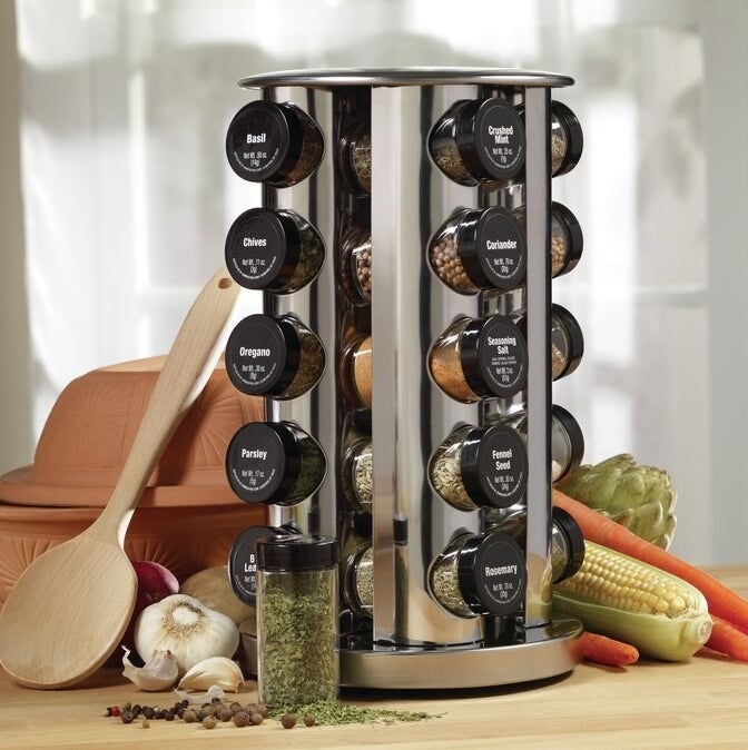 the spice rack filled with the various spice jars