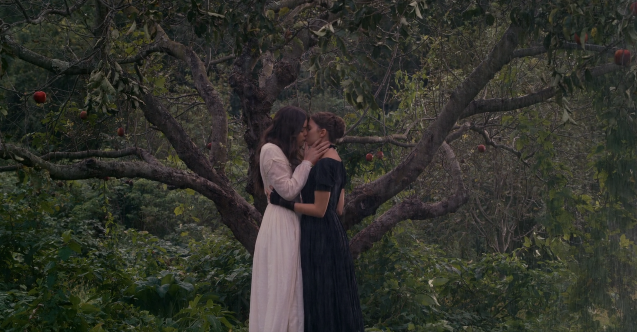 Emily and Sue kissing in the rain