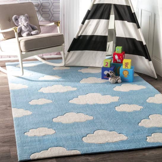 blue rug with white clouds 