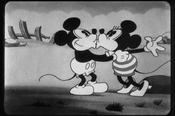 gif of Minnie and Mickey mouse kissing twice and then hugging