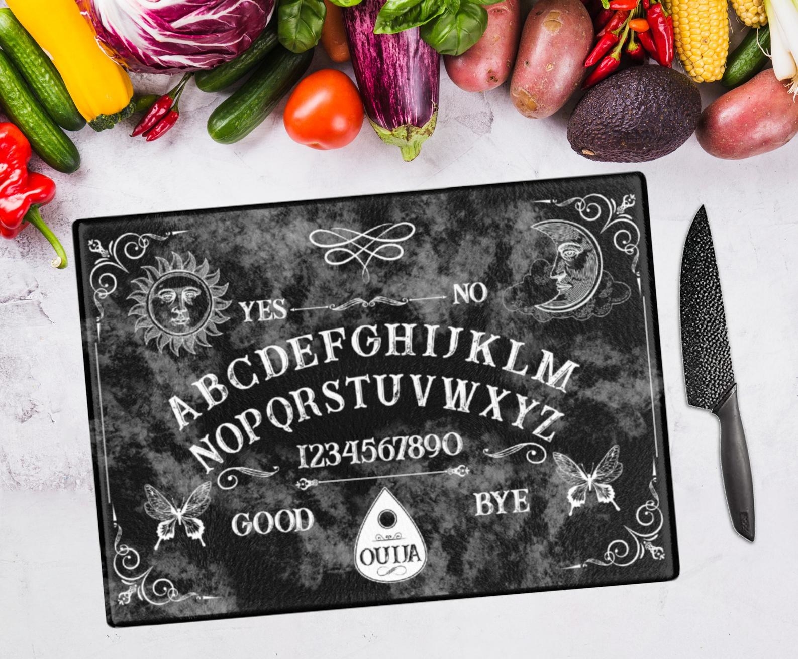 the black cutting board that looks like a ouija board