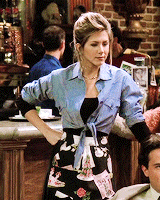 Rachel as a waitress at Central Perk on Friends looking frustrated