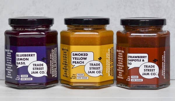 Three jars of the jams above in a line