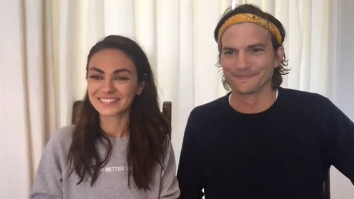 Mila Kunis, wearing a gray sweatshirt, and Ashton Kutcher, wearing a navy blue shirt and a yellow headband, appearing via video call on The Tonight Show Starring Jimmy Fallon on May 4, 2020