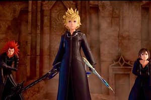Roxas standing between Axel and Xion to protect them.