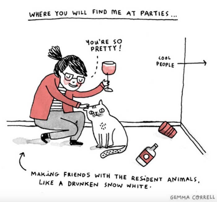 An introvert making friends with a cat at a party.